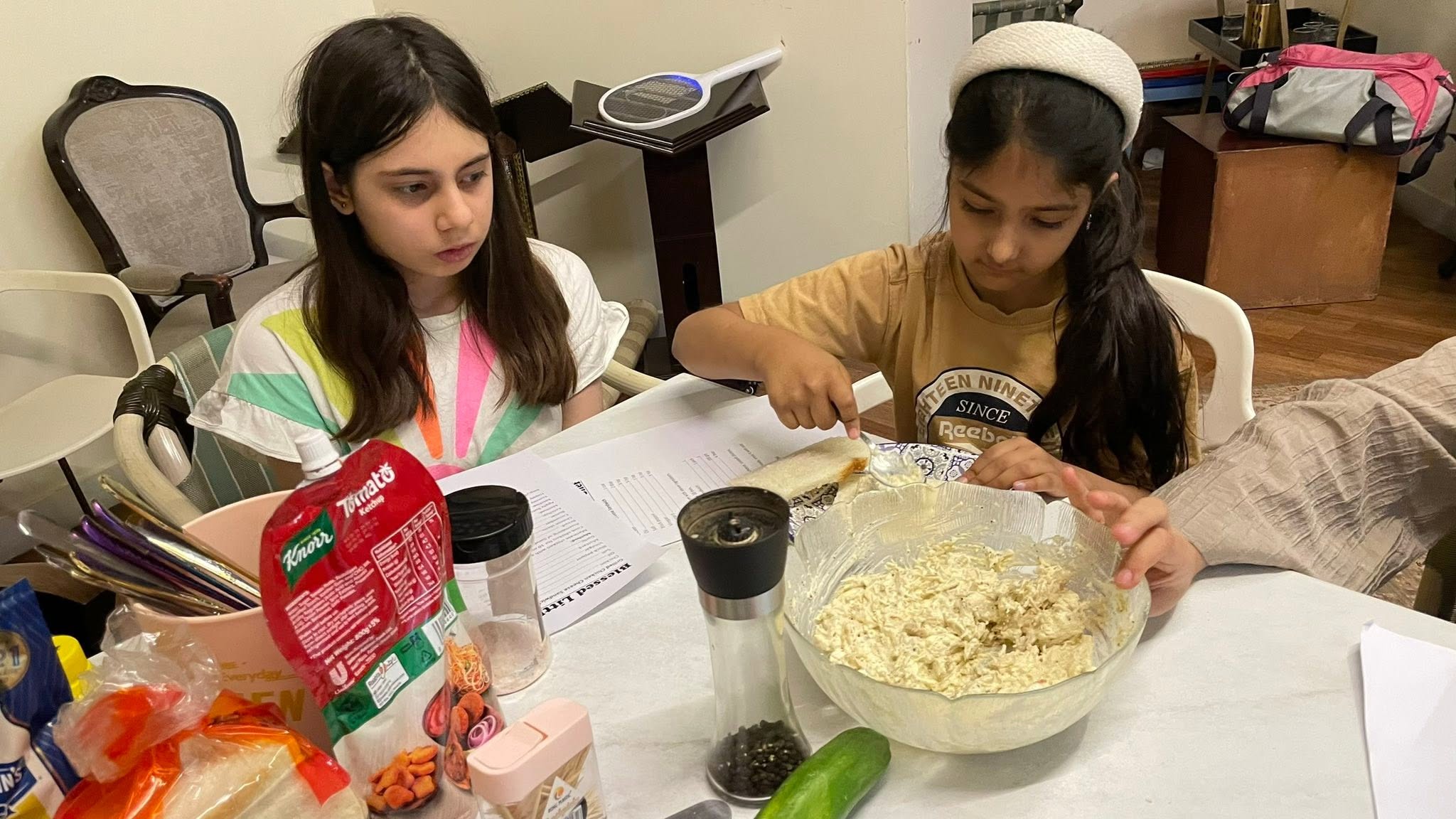 Young learners presenting dishes prepared during cooking class