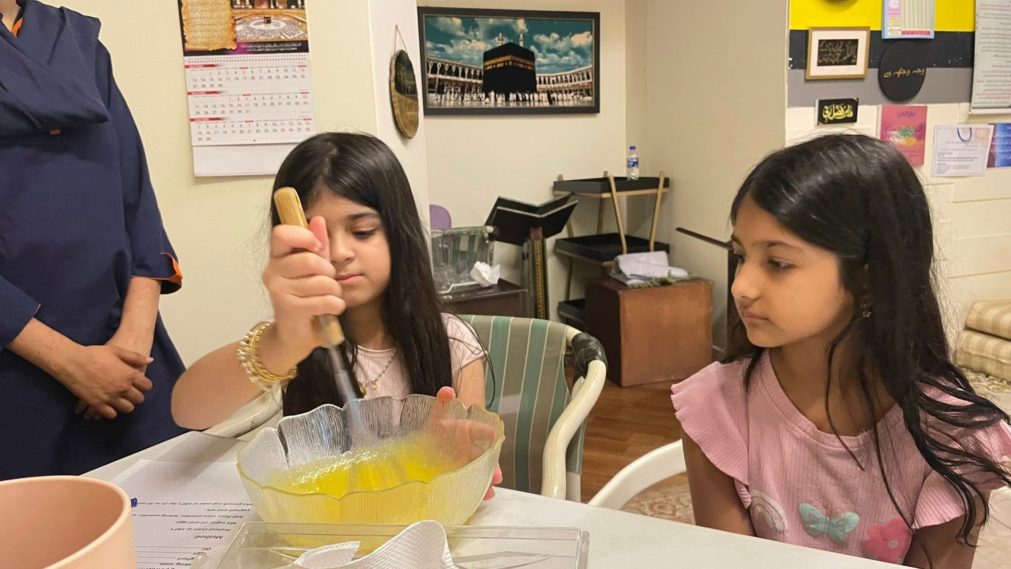 Young learner mixing ingredients during a cooking class